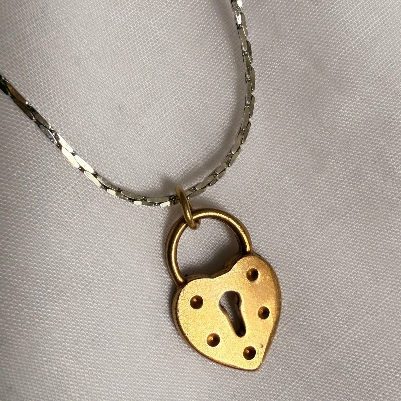 Silver necklace with brushed gold locket image 3
