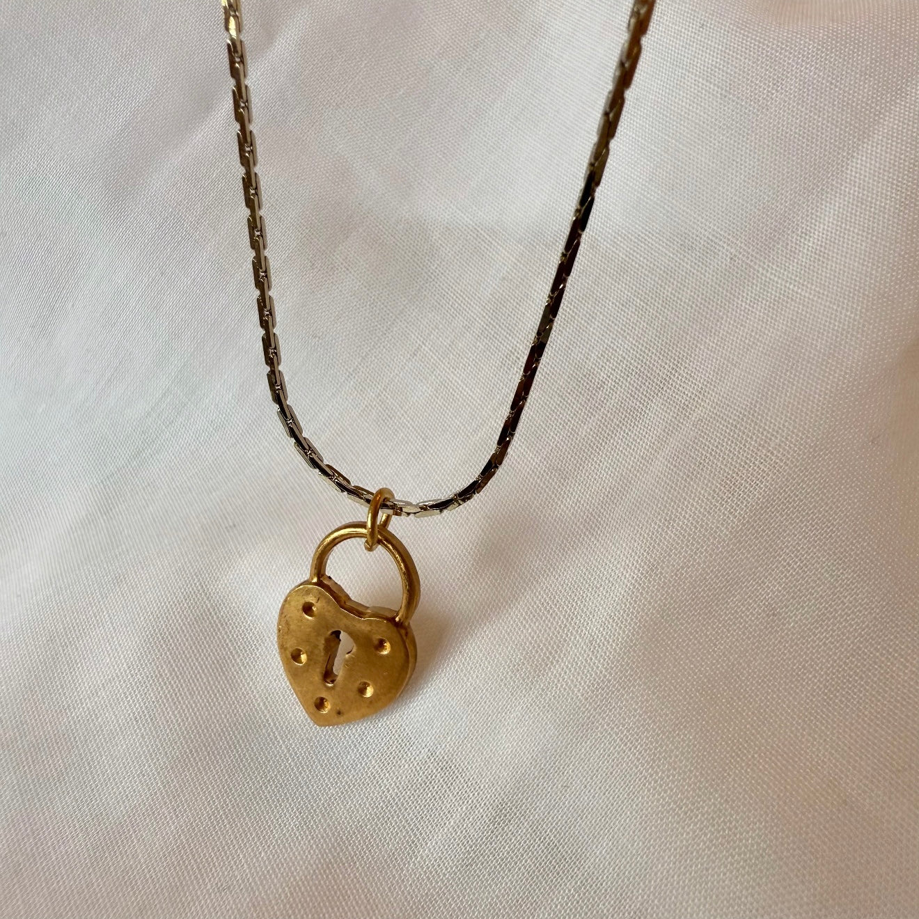 Silver necklace with brushed gold locket image 1