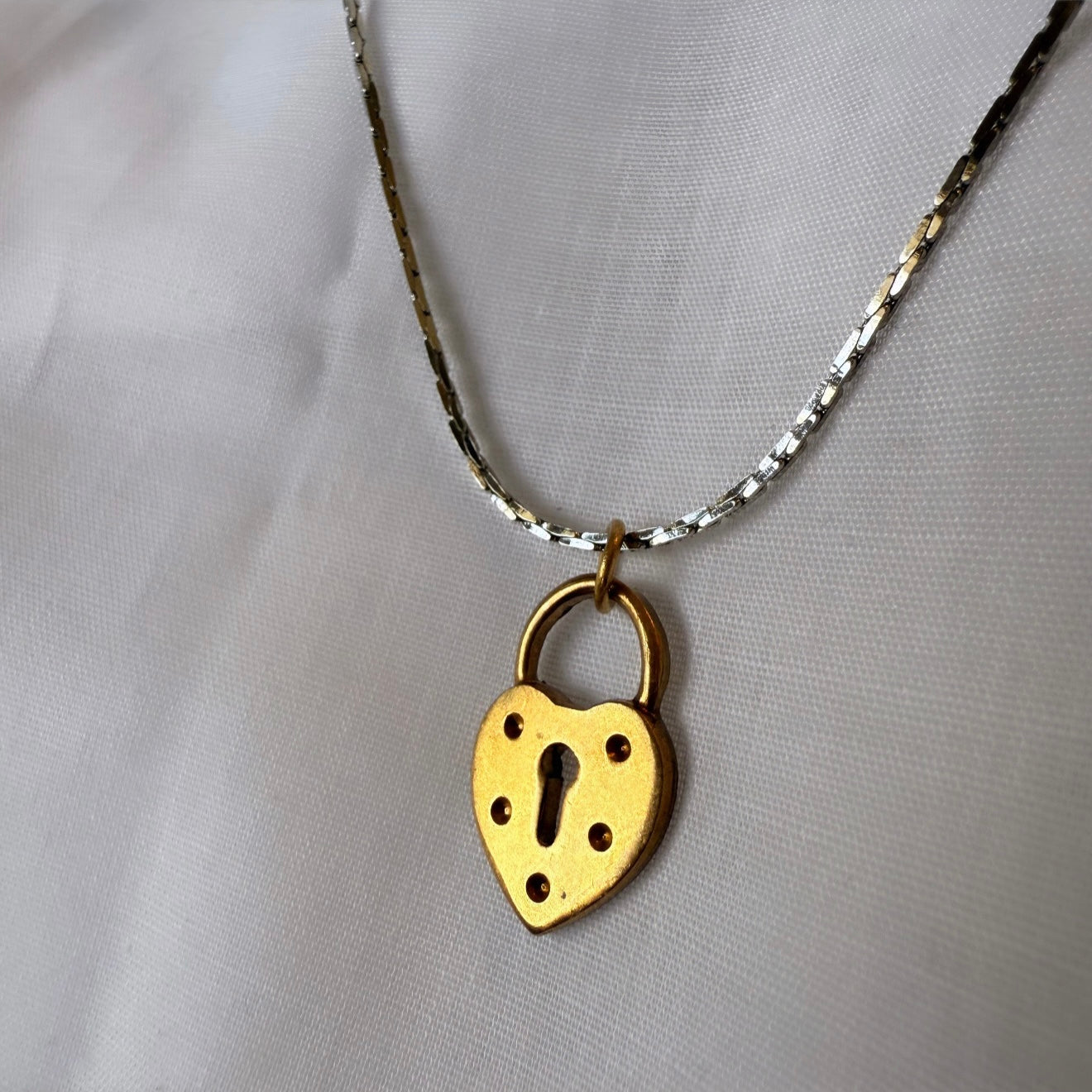 Silver necklace with brushed gold locket image 4