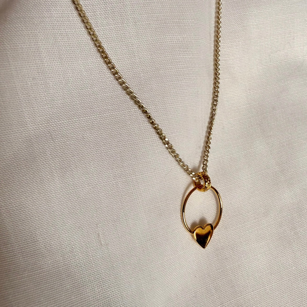 Silver necklace with gold heart door-knocker image 1