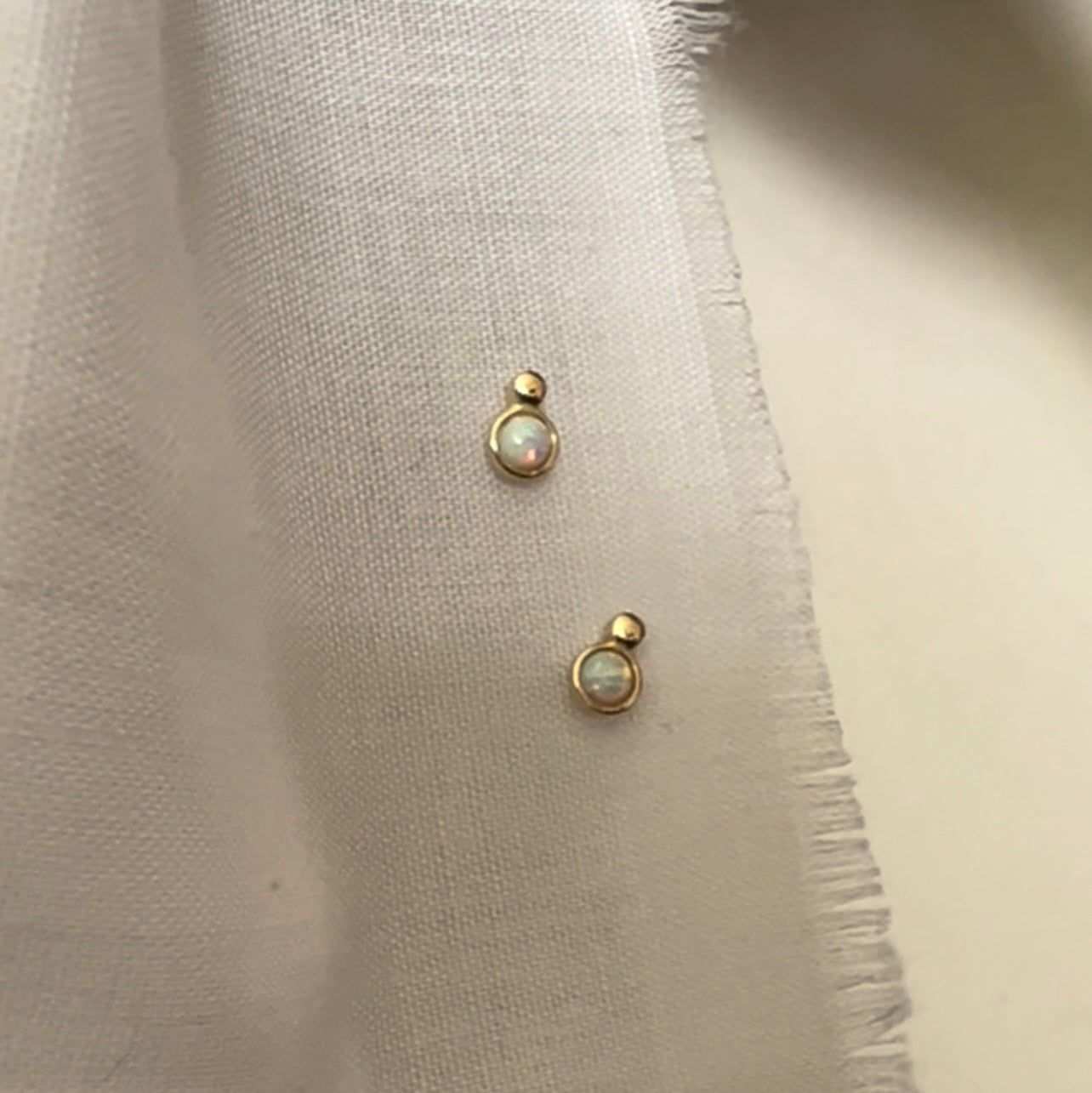 Tiny opal studs image 0